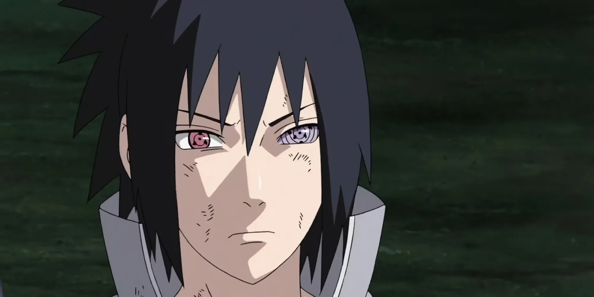Sasuke Uchiha với đôi mắt Sharingan và Rinnegan, biểu tượng của sức mạnh và sự báo thù trong Naruto