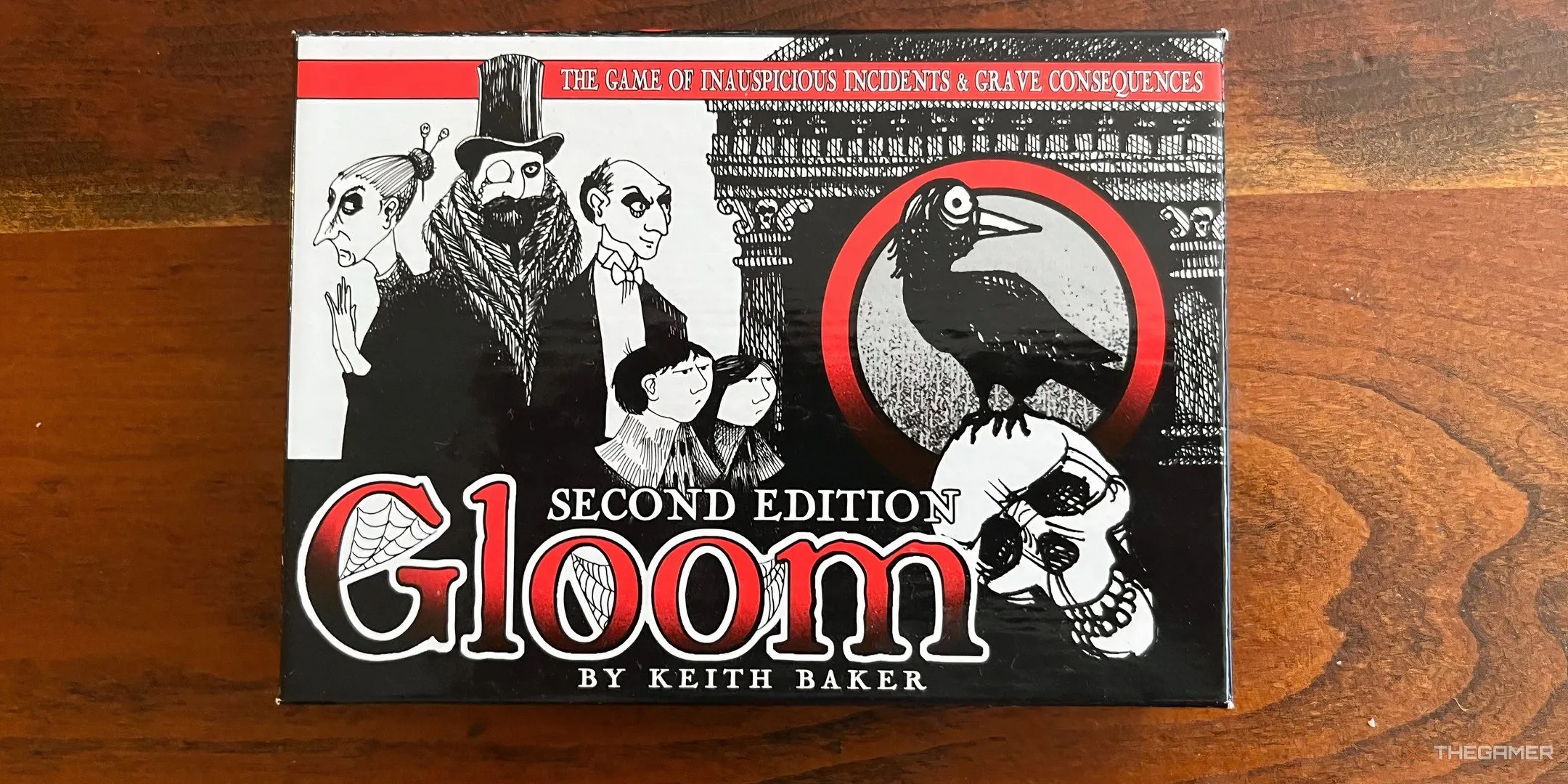 Bìa game Gloom với hình ảnh gia đình mang phong cách u ám, Gothic, thể hiện yếu tố kể chuyện bi kịch.